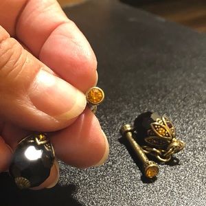 Pair of Heidi Daus bracelet and earrings charms.